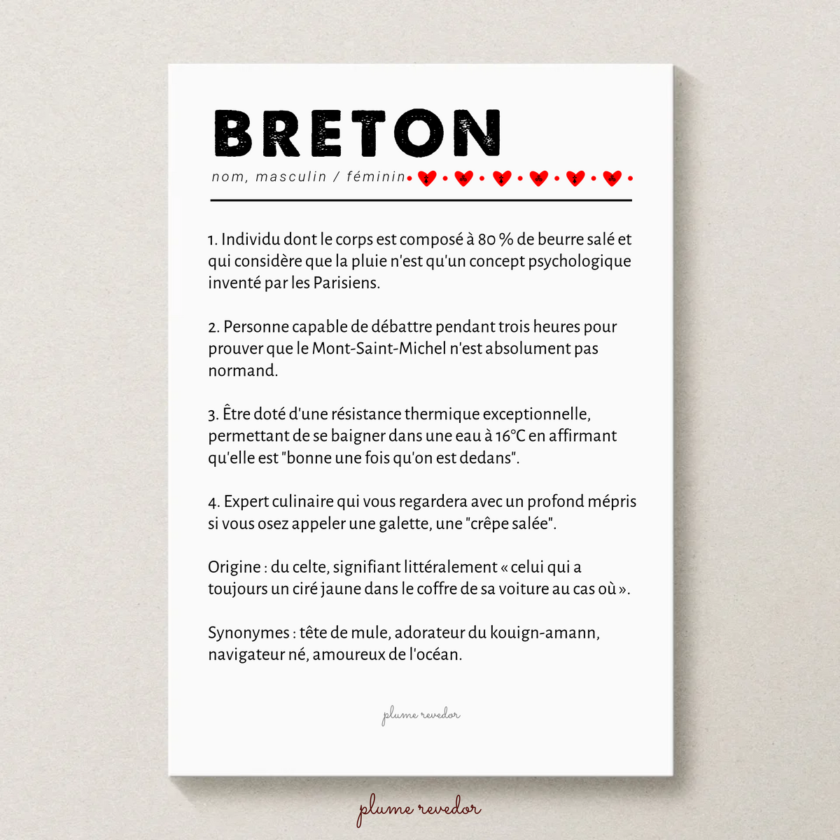 Affiche sans cadre avec la définition humoristique de Breton, texte noir et petits cœurs rouges sur fond blanc.